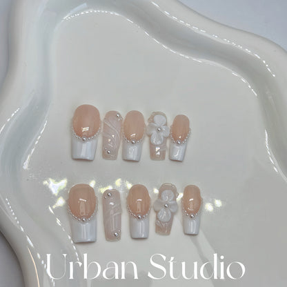Pearl Blossom Elegance press-on nails in square shape, medium length – detail view 2