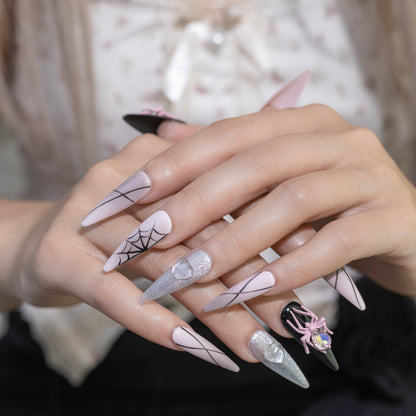 Pink Web press-on nails in stiletto shape, long length