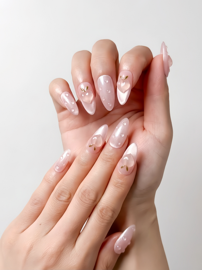 Peach Dew medium almond pink press-on nails with 3D peach charms and dew drops